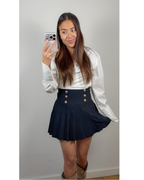 Toor zwart rokje met gouden knoopjes